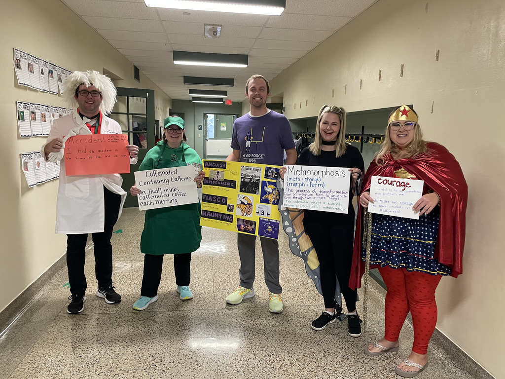 Fourth grade educator team costumes with their vocabulary sign 