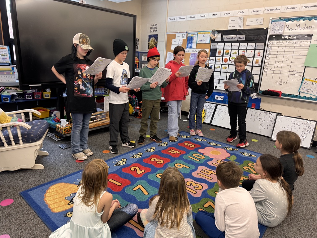 Attentive first graders enjoy a readers theater presentation from 4th grade students at Pine City elementary