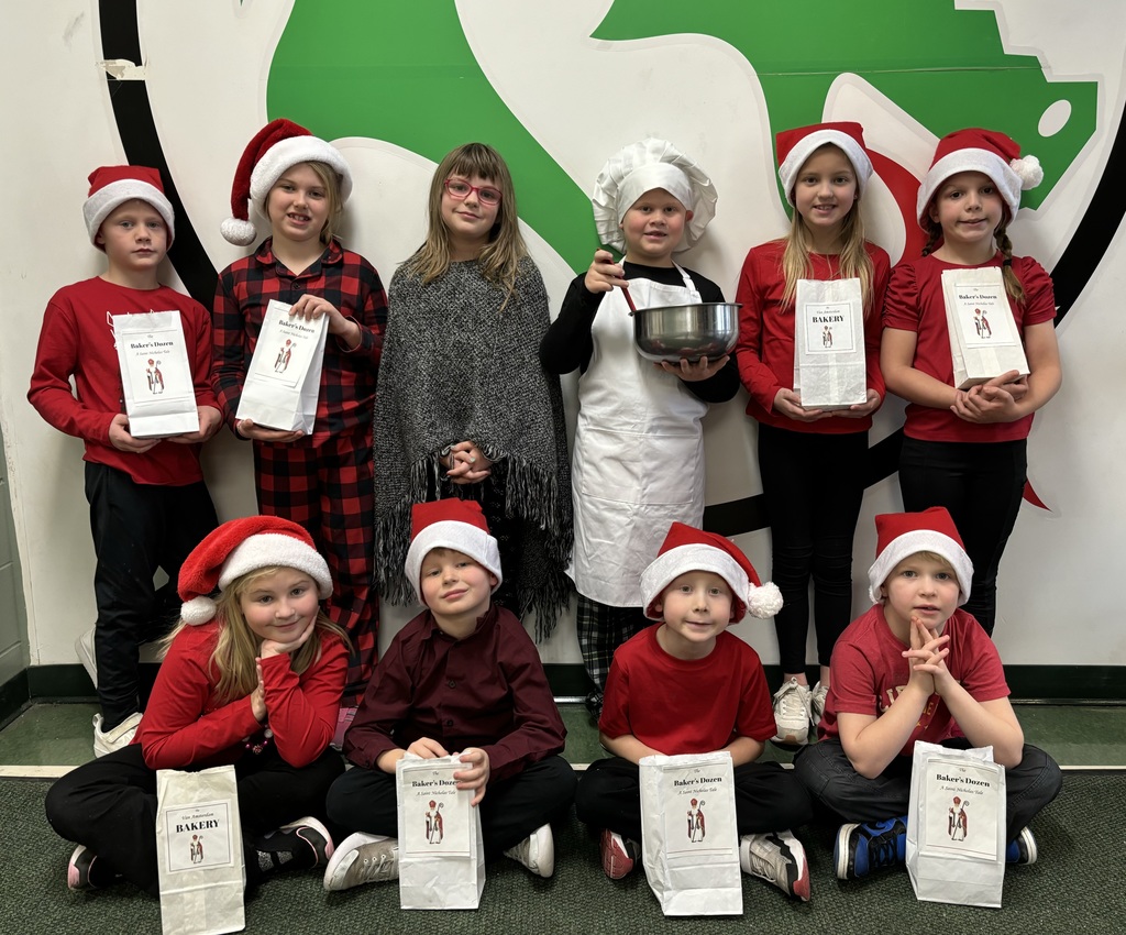 2nd graders posing to get ready to go perform a reader's theater of The Baker's Dozen: A Saint Nicholas Tale