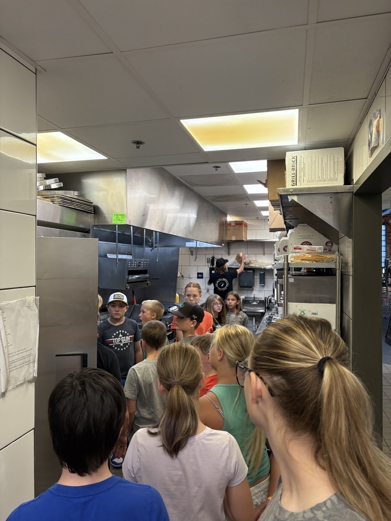 4th grade students tour the kitchen at The Garage Bar & Grill