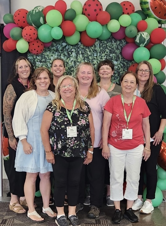 Eight members of the Food Services Team at Pine City Schools pose for a photo at the annual Nutrition Conference in St. Cloud