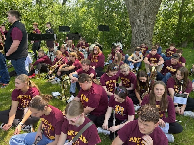 band students sitting outside