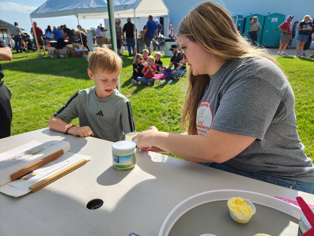 boy and girl making butter