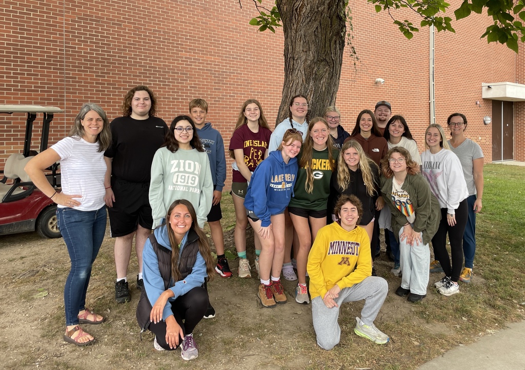 students standing by a tree