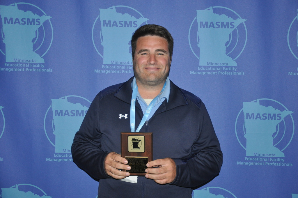 picture of craig with his plaque. 