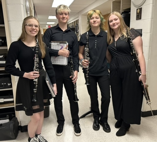 Pine Island High School Solo/Ensemble Contest is happening at school all day today. Pictured are two of the band senior ensembles ready to perform for their last high school contest.  As part of the curriculum, every band, choir, and orchestra student in grades 9-12 are required to perform a solo or small ensemble for the event. In addition, grade 7-8 orchestra students also perform solos. The students are scored by judges from outside of the school district.  Good luck to all of our musicians.