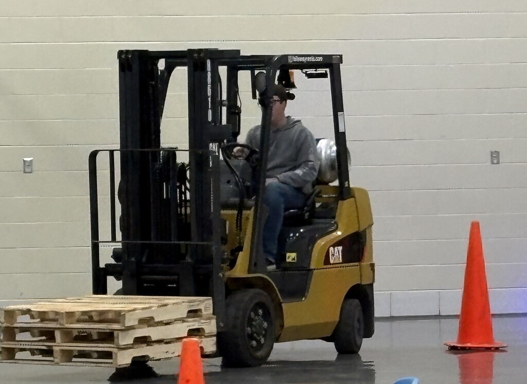 Student driving a forklift