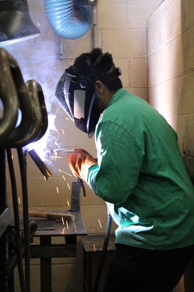 Student learning to weld