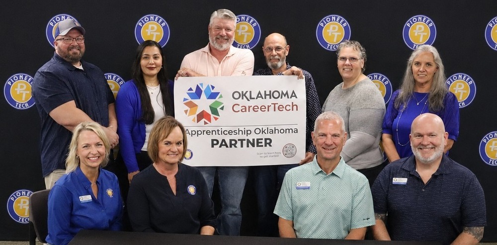 Staff from Lopez Dorada Foods and Pioneer Tech holding an Oklahoma CareerTech Apprenticeship Oklahoma Partner Sign