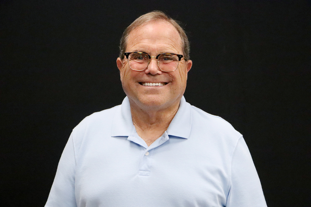 Pioneer Tech man with glasses and light blue shirt. 
