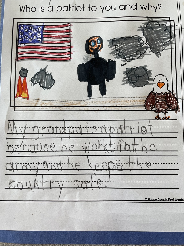 Student writing with illustration about a patriot. With student drawing and clipart of the american flag and eagle. 