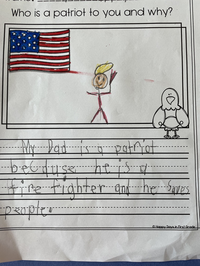 Student writing with illustration about a patriot. With student drawing and clipart of the american flag and eagle. 