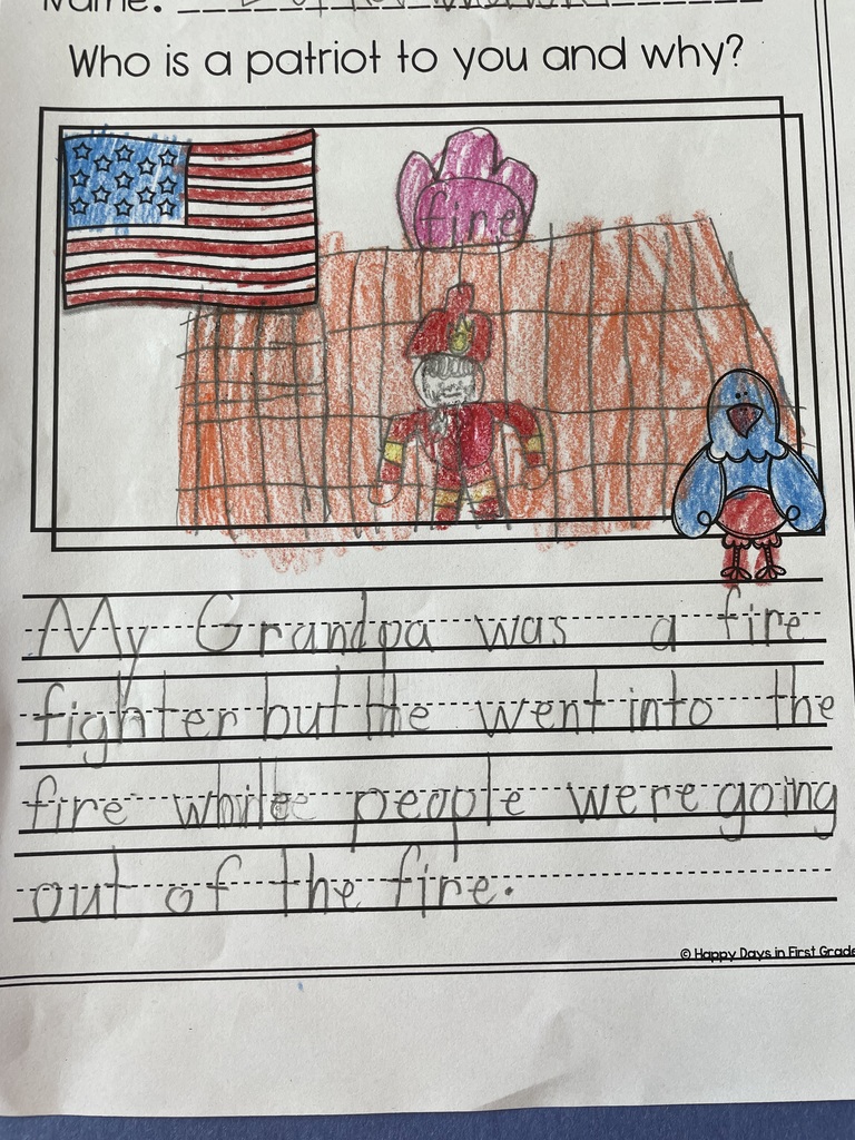 Student writing with illustration about a patriot. With student drawing and clipart of the american flag and eagle. 