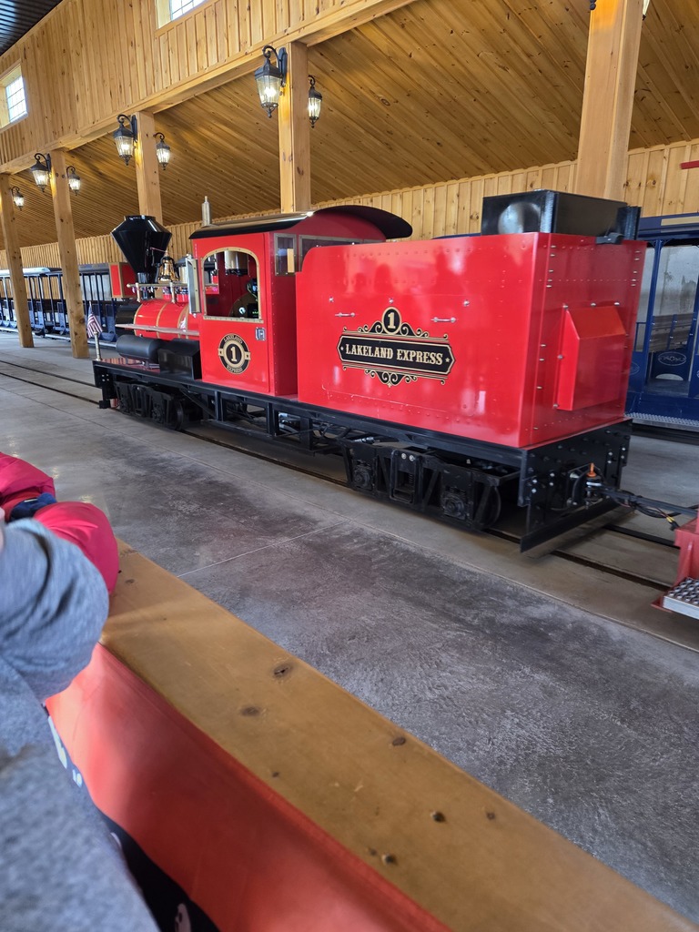 Kids at an apple orchard smiling.