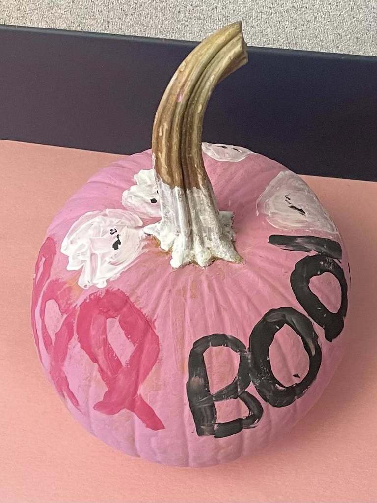 a pink pumpkin with "boo" 