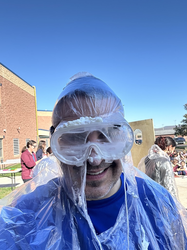 Mr. Savokinas covered in whipped cream after being pied.