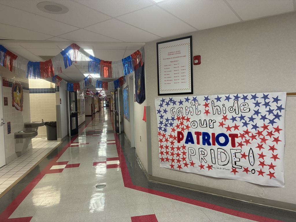 A hallway decorated with red and blue and a banner that says can’t hide our PATRIOT PRIDE!