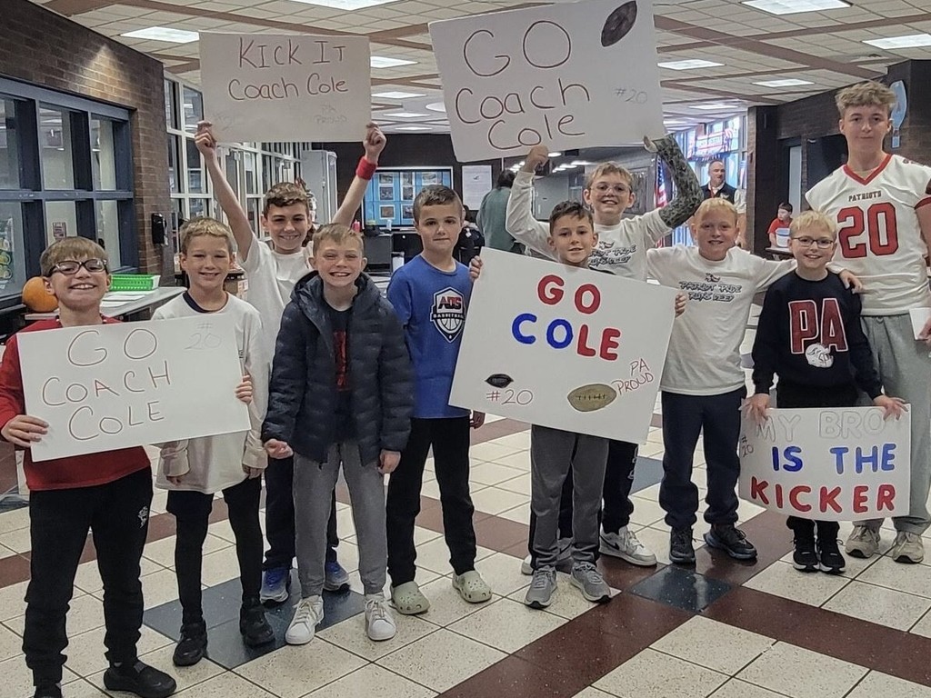 students celebrating their coach