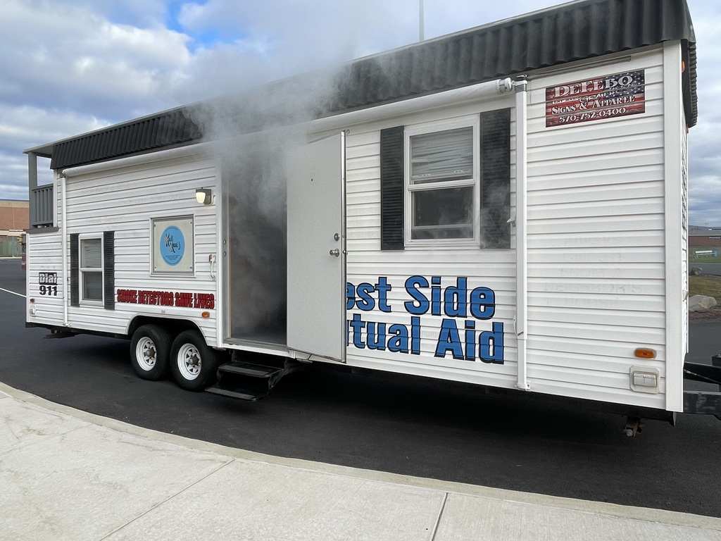 A smoke house filled with smoke.