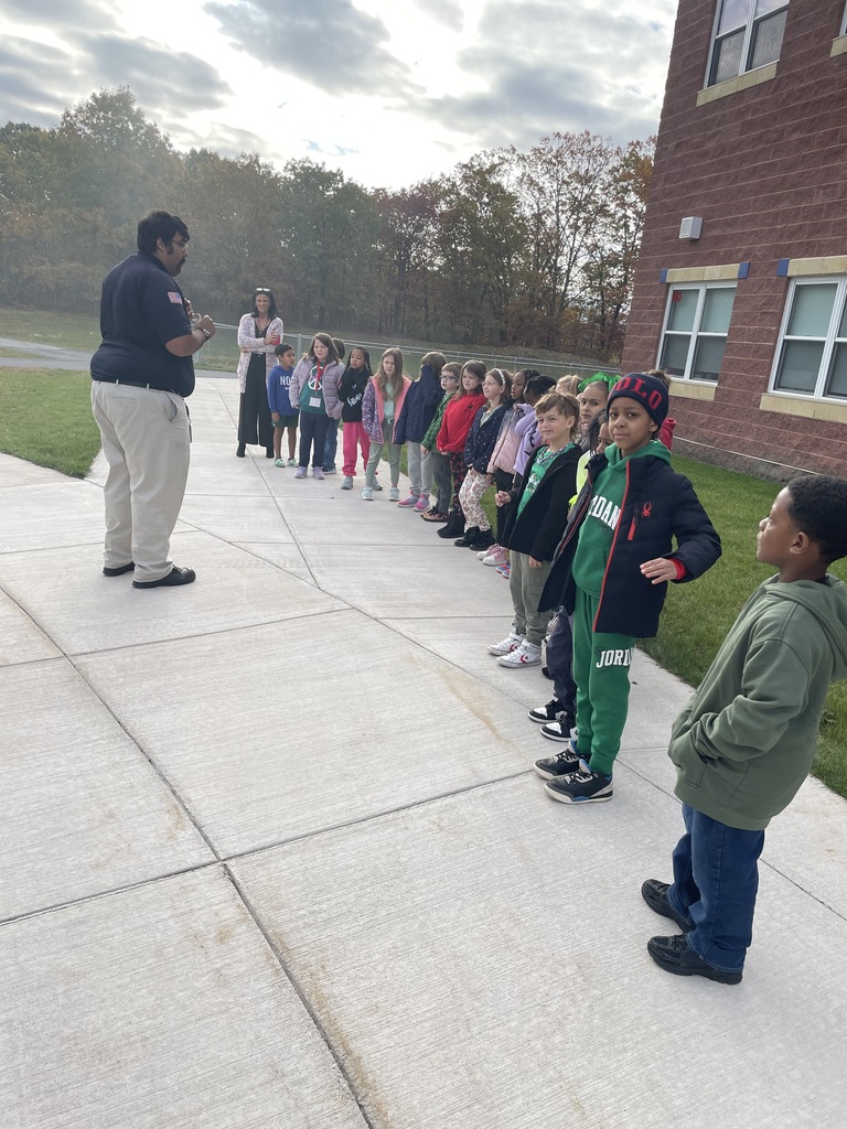 A firemen talking to a group of students.