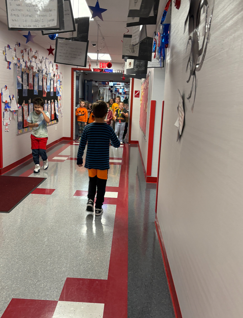 Students participating in a stem challenge.