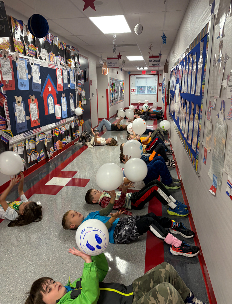 Students participating in a stem challenge.