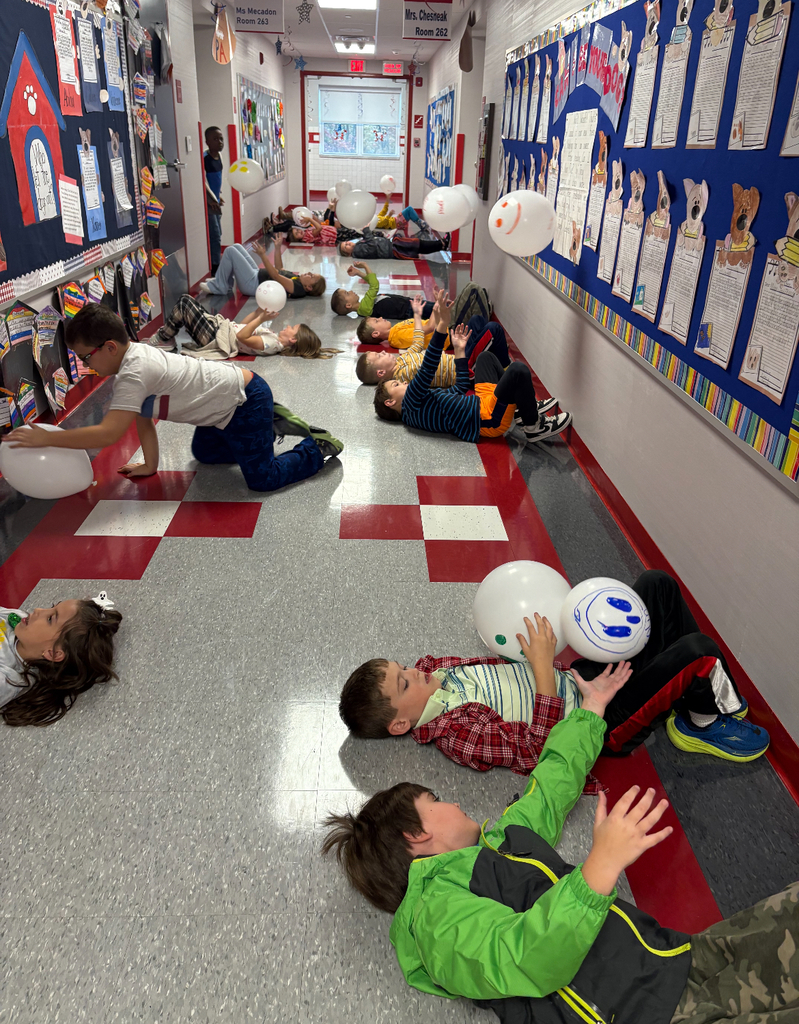 Students participating in a stem challenge.