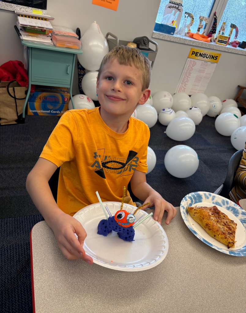 Students participating in a stem challenge.