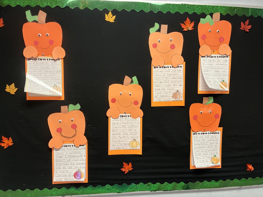 School bulletin board with fall writing.