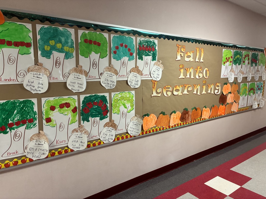 School bulletin board with fall writing.