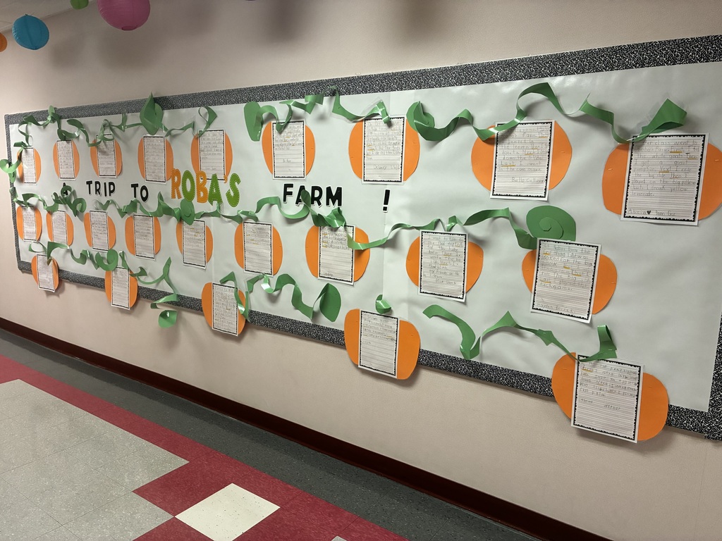 School bulletin board with fall writing.