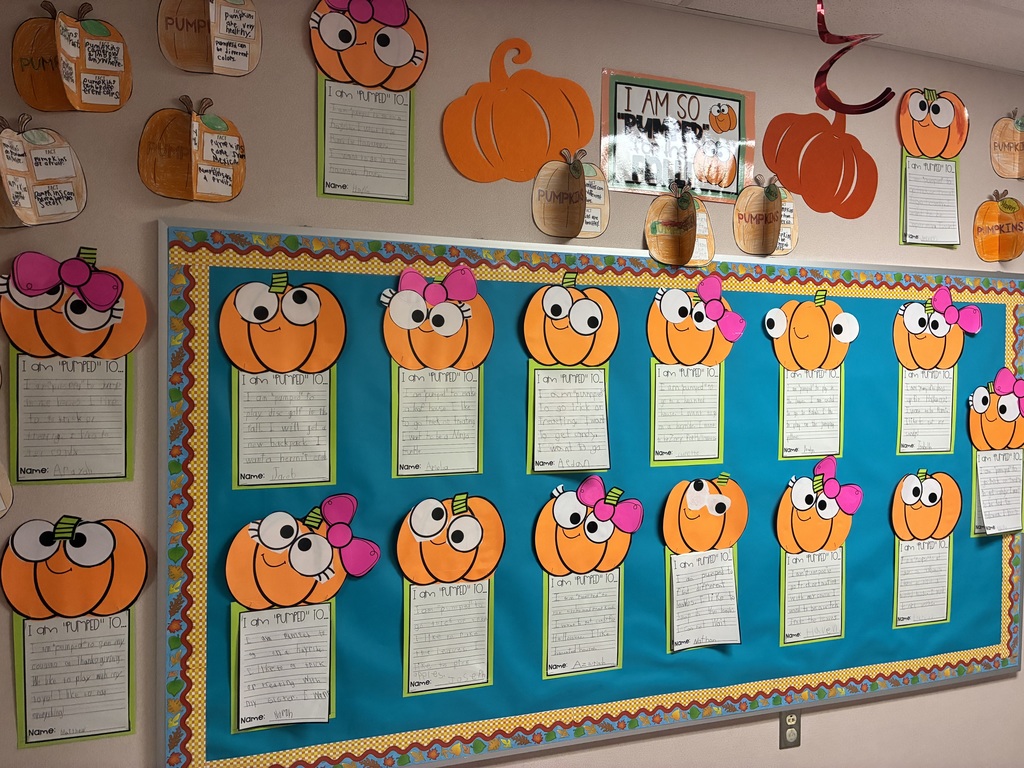 School bulletin board with fall writing.