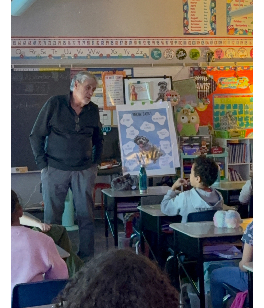Dr. Imbrogno talking to first grade students in a classroom