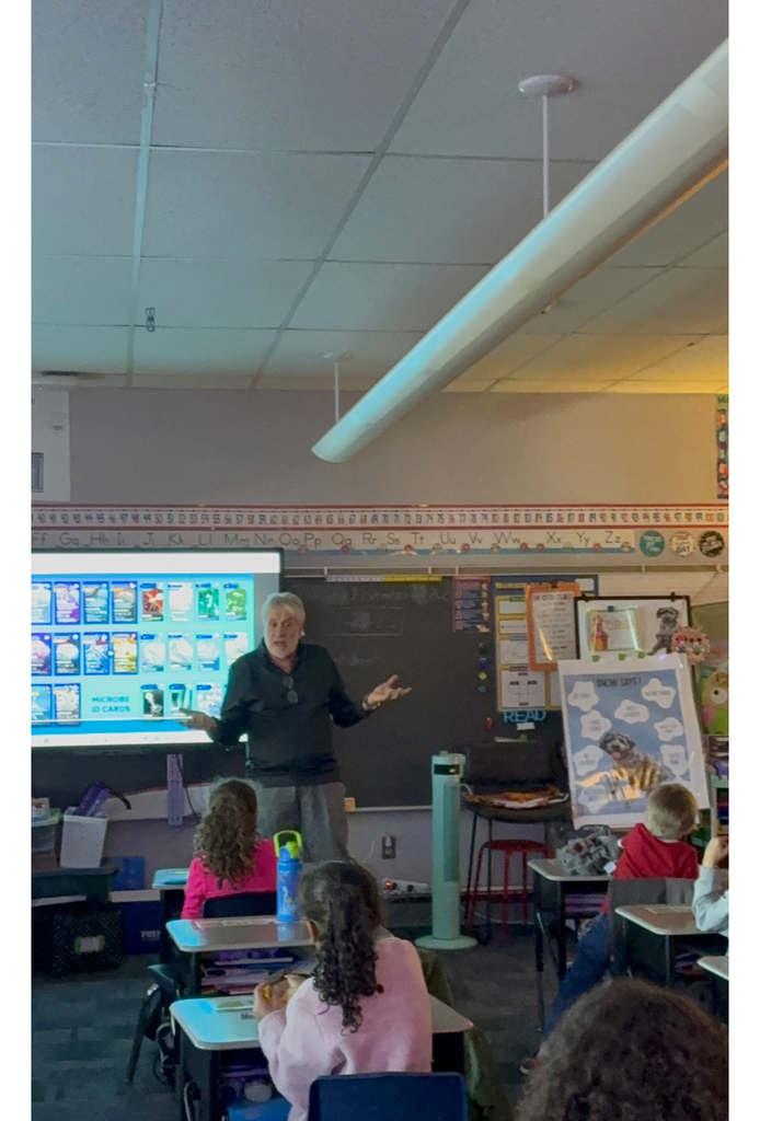 Dr. Imbrogno talking to first grade students in a classroom