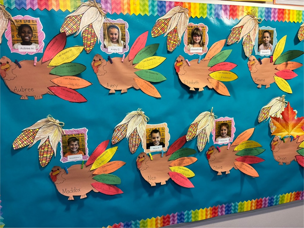 A bulletin board with student writing pieces displayed.