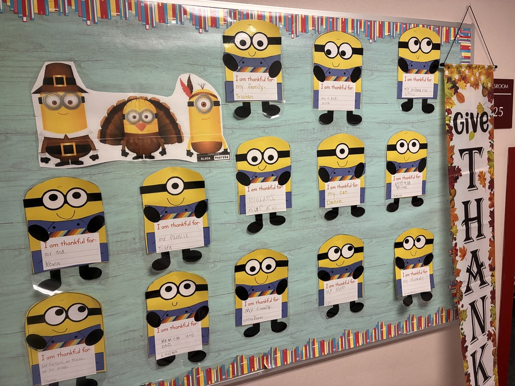 A bulletin board with student writing pieces displayed.