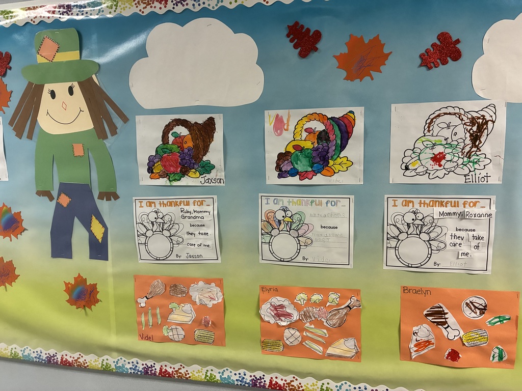 A bulletin board with student writing pieces displayed.