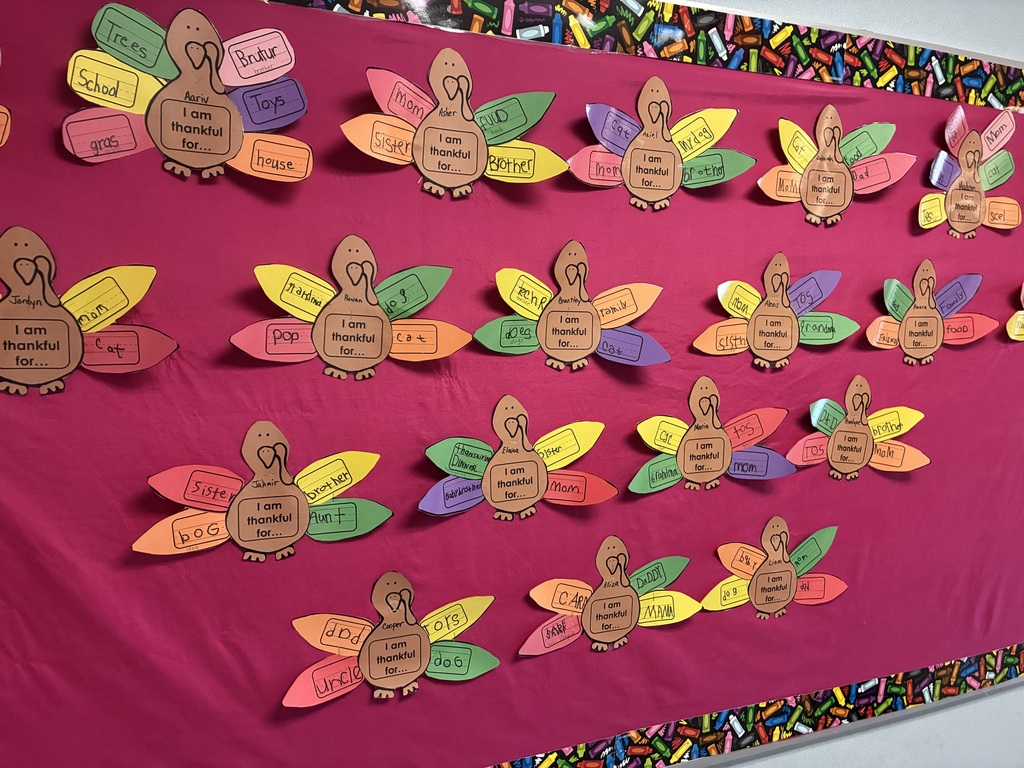 A bulletin board with student writing pieces displayed.