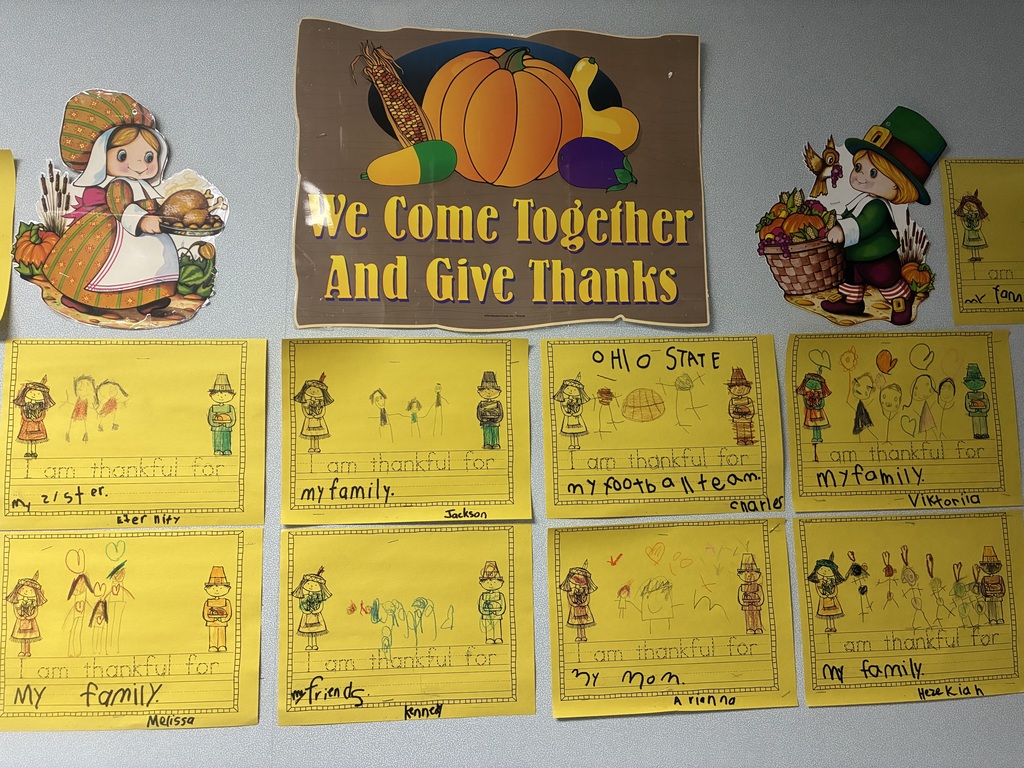 A bulletin board with student writing pieces displayed.