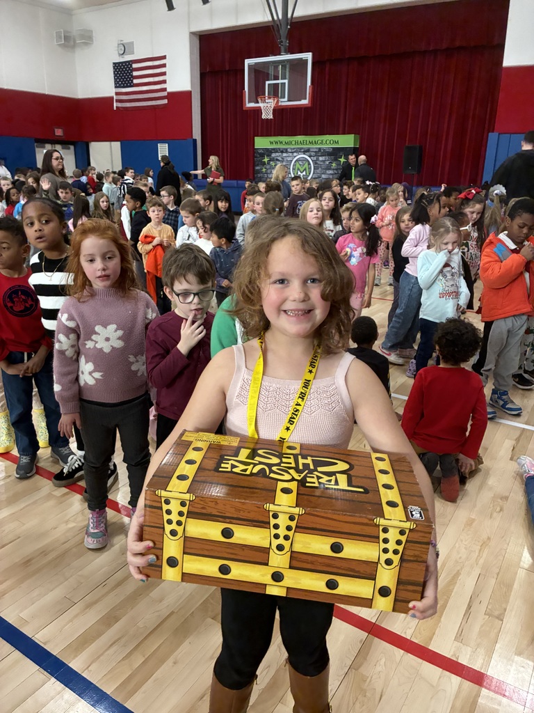 A girl holding a cardboard treasure chest