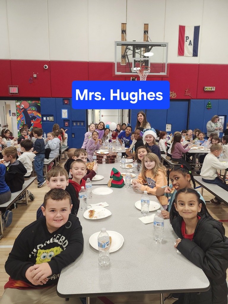 Students at a pizza party in the cafeteria . 