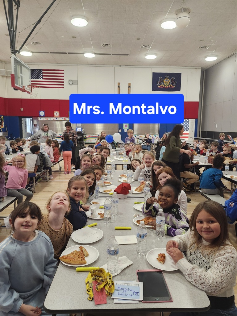 Students at a pizza party in the cafeteria . 