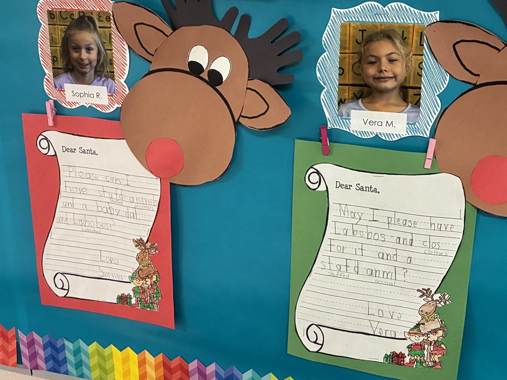 Student written letters to santa displayed on a bulletin board. 