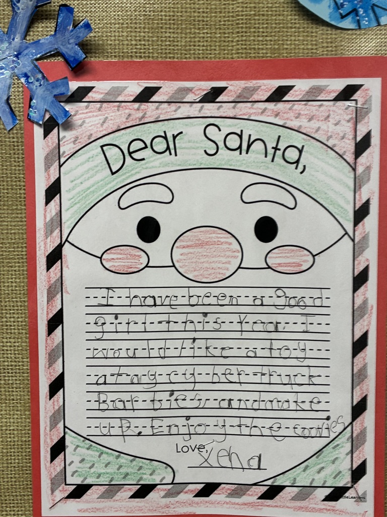 Student written letters to santa displayed on a bulletin board. 