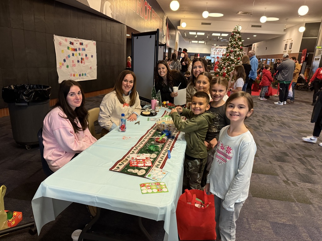 Kids at a craft table. 