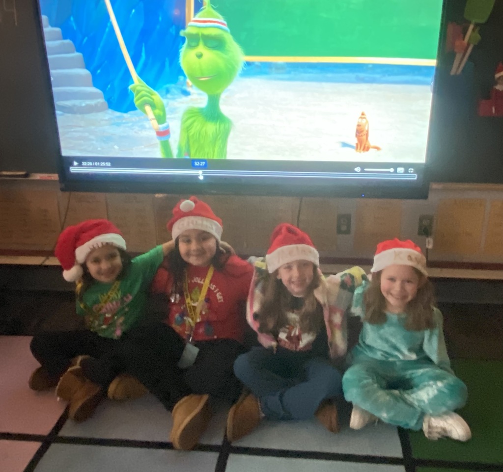 A group of students doing holiday festivities in their classroom. 