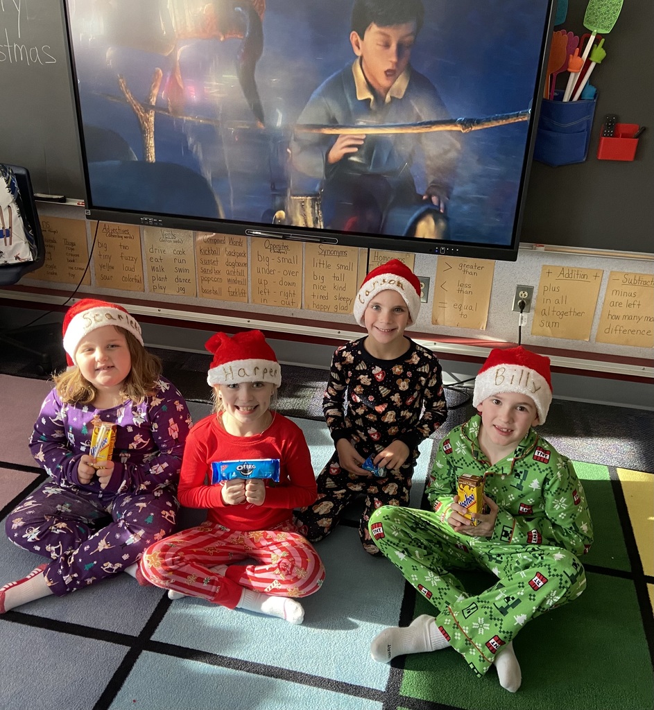 A group of students doing holiday festivities in their classroom. 