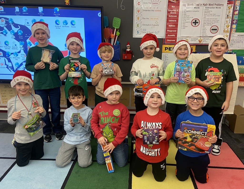 A group of students doing holiday festivities in their classroom. 