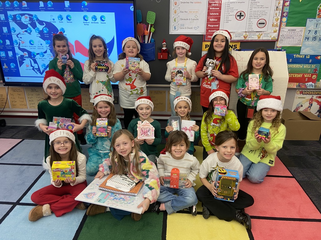 A group of students doing holiday festivities in their classroom. 