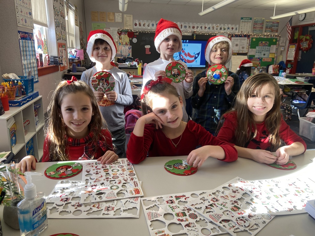 A group of students doing holiday festivities in their classroom. 
